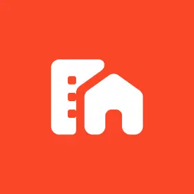 Icon of a white building and house silhouette on an orange background, symbolizing versatile living options such as mobile home rentals.